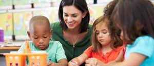 Therapist playing with a group of children